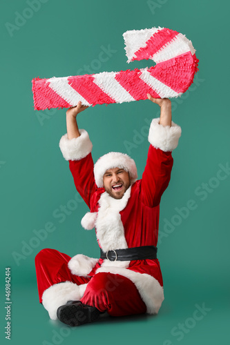 Happy Santa Claus with cand...