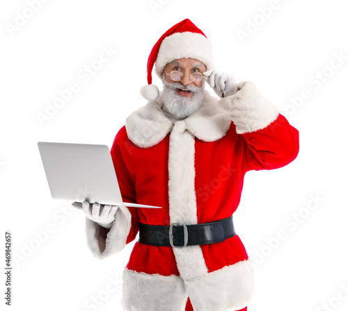 Santa Claus with modern lap...