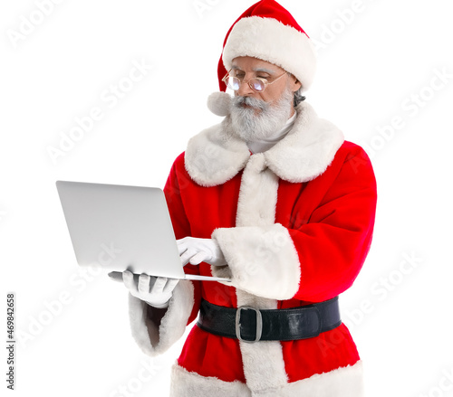 Santa Claus with modern lap...