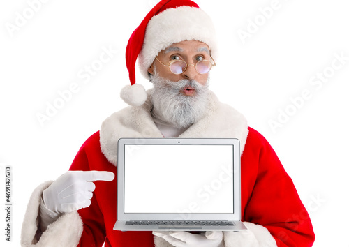 Santa Claus with modern lap...