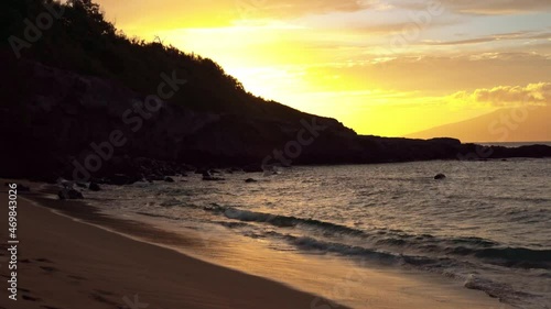 Tranquil water reaching Slaughterhouse Beach or Mokuleʻia Beach in Maui,Hawaii during sunset photo