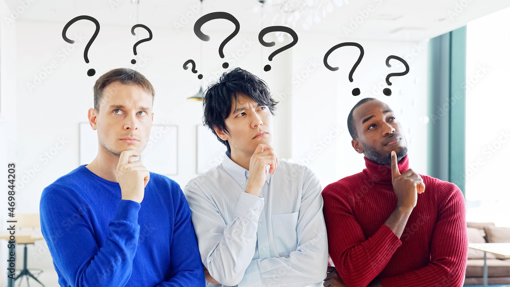 © metamorworks - Group of multi racial people thinking in the office. Global business.