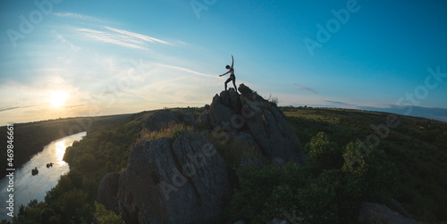 silhouette of a girl on top of a mountain