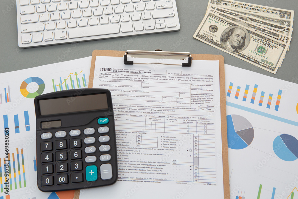 tax season. 1040 tax form background with calculator. tax season. 1040 tax form background with calculator.
