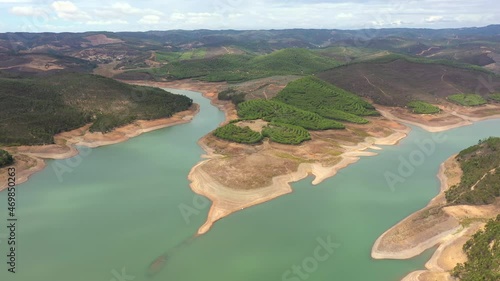 Vast Forest And Mountain Landscape In The Bravura Dam In Lagos Portugal - aerial shot photo