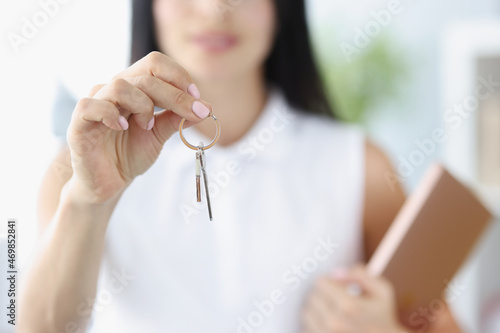 Canvas Print Agent or realtor holding key to new landlord or tenant or rental