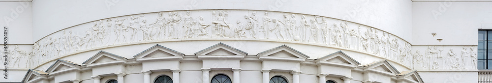 Stitched panorama of long relief on Teacher house facade in Kyiv Ukraine