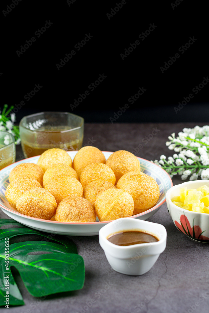 Indian traditional snack. Pani puri with boiled potato and sauce. Stock