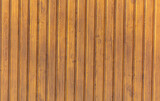Wooden boards in the wall as a background.