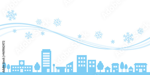 雪が舞う街並みの背景