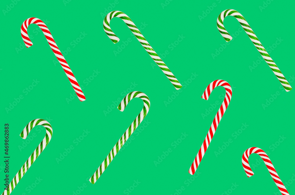 christmas candy red and green lollipop isolated on green background, kids festive sweets and treats christmas candy red and green lollipop isolated on green background, kids festive sweets and treats