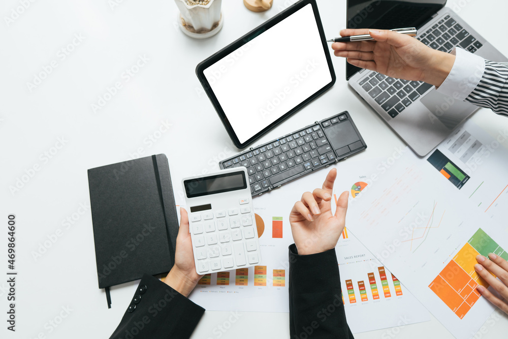 Business concept. Business people discussing the charts and graphs showing the results of their successful teamwork. Business concept. Business people discussing the charts and graphs showing the results of their successful teamwork.