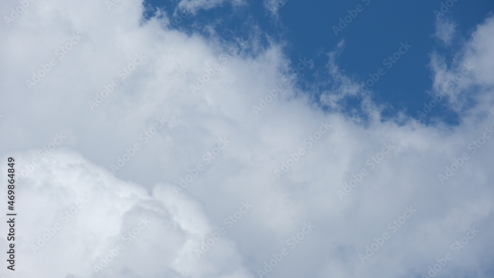 Naklejka premium View of beautiful blue sky background with white clouds at the noon, Bangkok, Thailand.