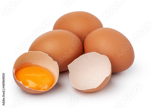Brown raw eggs and one broken isolated on white background