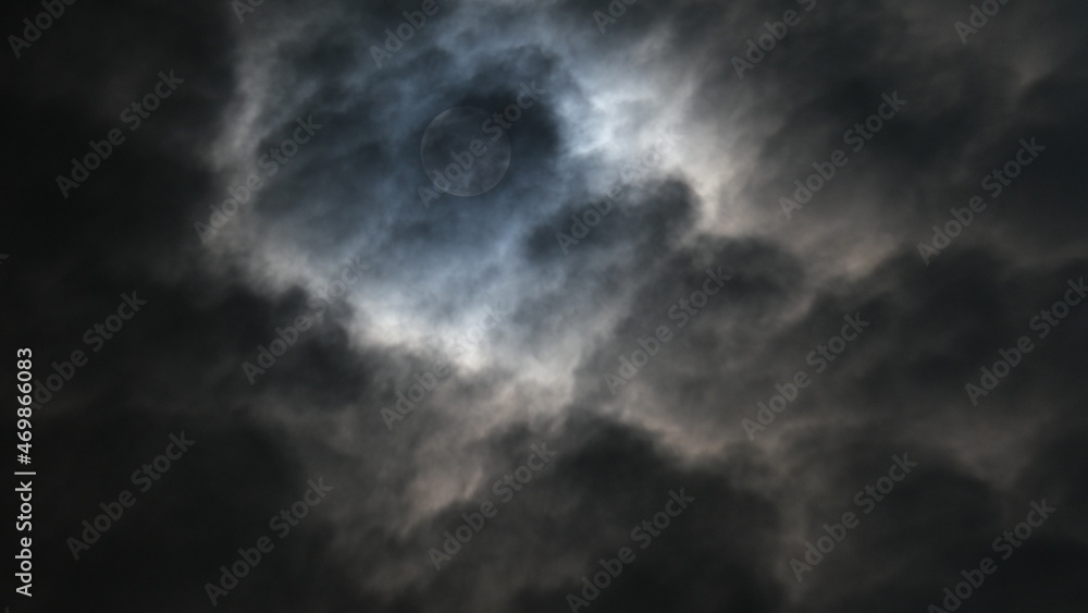 The beautiful full moon is shining with the white clouds in the sky at night in Bangkok, Thailand. The beautiful full moon is shining with the white clouds in the sky at night in Bangkok, Thailand.