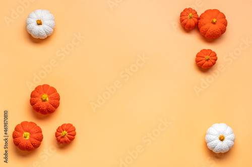 Orange, white, orange pumpkin isolated on beige background Top view Flat lay Hello autumn, happy thanksgiving concept Holiday card