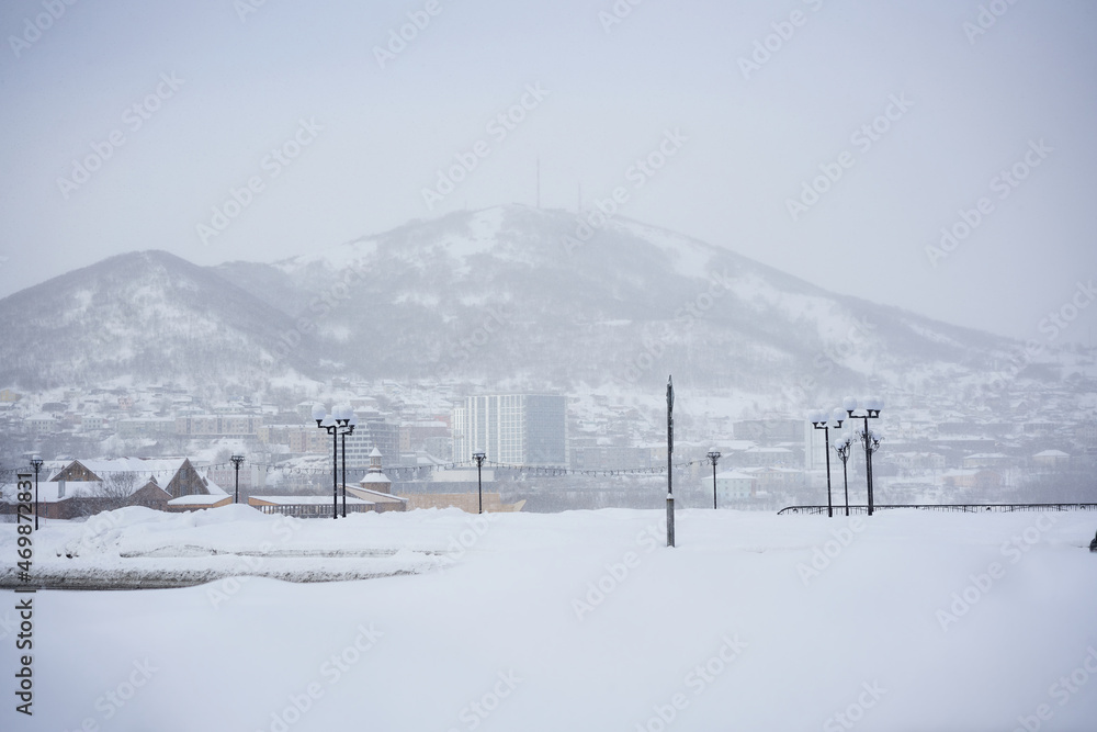 Petropavlovsk Kamchatsky city in the winter at snowy weather. Kamchatka peninsula, Russia Petropavlovsk Kamchatsky city in the winter at snowy weather. Kamchatka peninsula, Russia