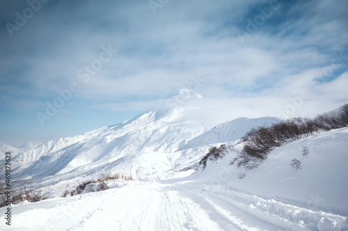 Winter landscape. Vilyuchinsky volcano covered with snow against blue sky. Kamchatka peninsula, Russia © Mikhail Mishchenko