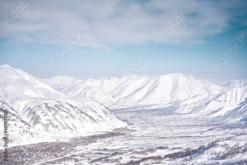 Winter landscape. Snow covered mountains covered with snow against blue sky. Kamchatka peninsula, Russia © Mikhail Mishchenko
