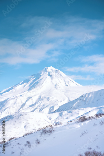 Winter landscape. Vilyuchinsky volcano covered with snow against blue sky. Kamchatka peninsula, Russia © Mikhail Mishchenko