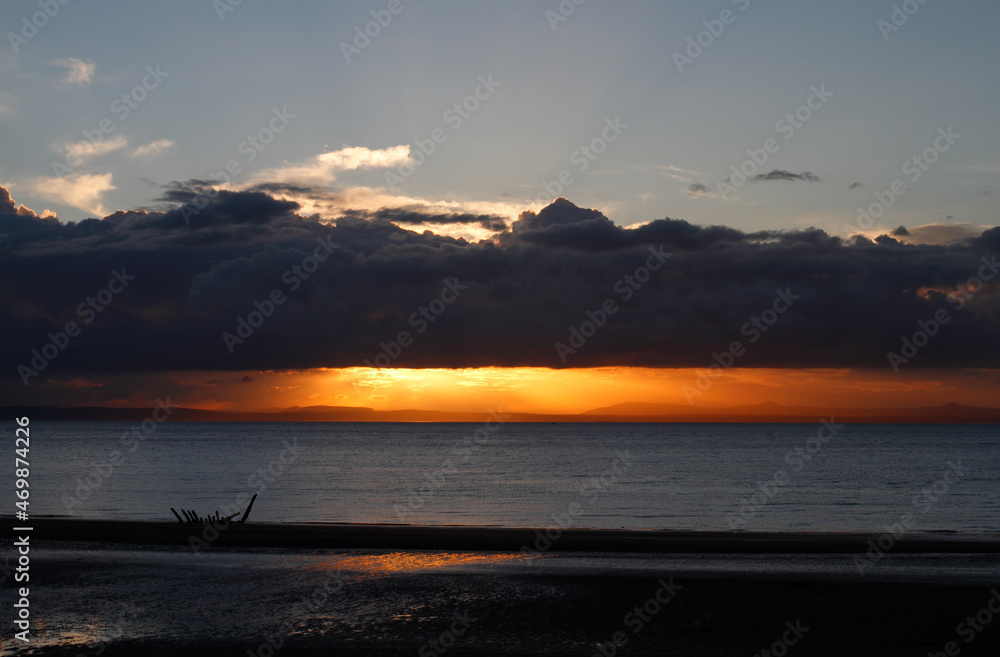 sunset over the sea with wreck sunset over the sea with wreck