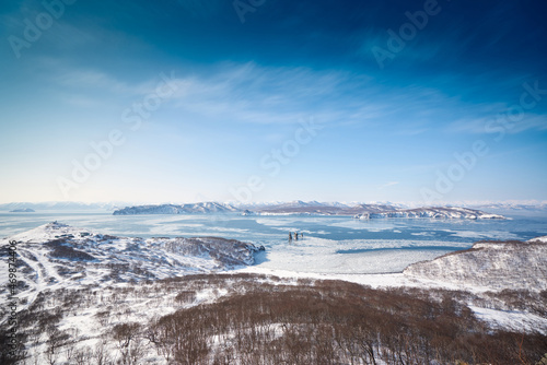 Winter landscape of the Avacha bay. Snowy mountains and blue ocean. Kamchatka peninsula, Russia © Mikhail Mishchenko