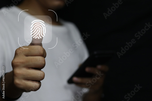 businessman scan fingerprint biometric identity and approval. concept of the future of security and password control through fingerprints in an immersive technology future and cybernetic.
