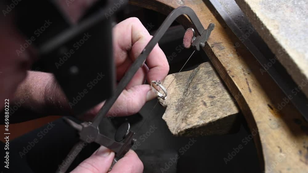 Closeup of wedding ring crafting by caicasian jeweler in home workroom, 4k high quality footage Closeup of wedding ring crafting by caicasian jeweler in home workroom, 4k high quality footage