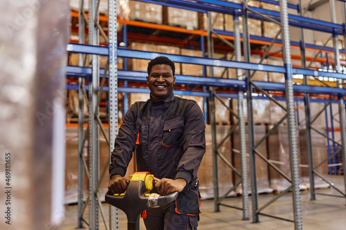 Cheerful factory employee, happily working and enjoying. © bnenin