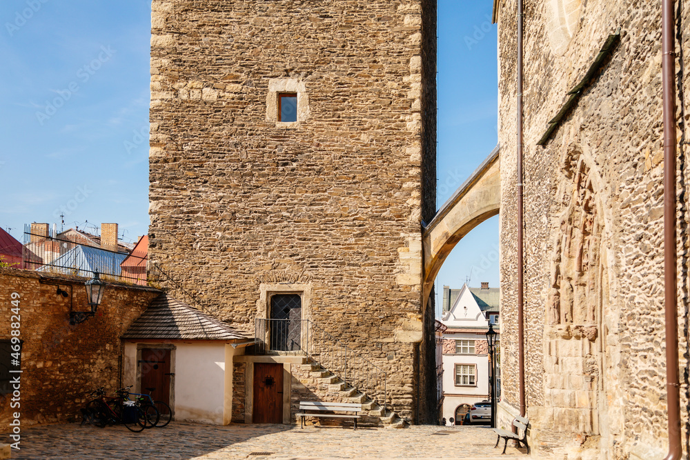 Kolin, Central Bohemia, Czech republic, 10 July 2021: Medieval stone St. Bartholomew´s Church with tower in sunny summer day, arched windows, chimeras and gargoyles, Gothic Cathedral with belfry