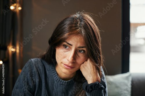 Thoughtful woman looking away photo