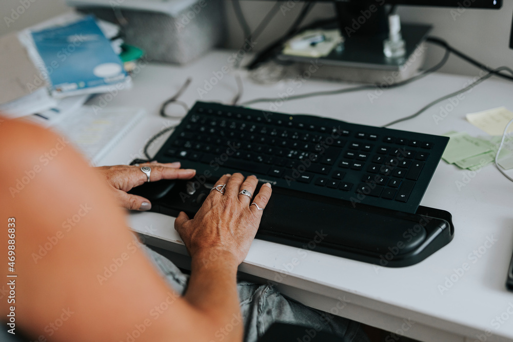 Woman's hands using computer Woman's hands using computer