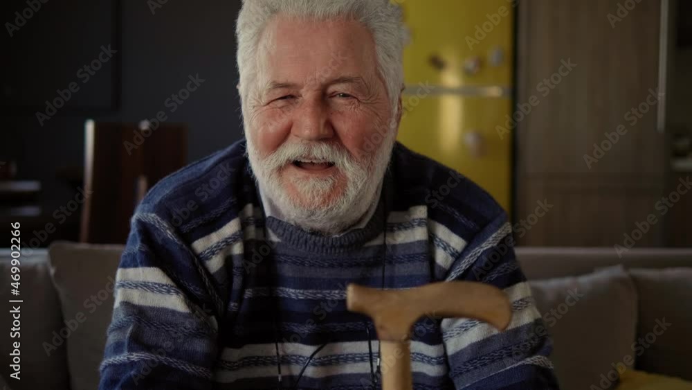 Desperate elderly man looking at camera with angry facial expression and changes into laughter. Uncontrolled behavior of changing emotions. Mental problem Desperate elderly man looking at camera with angry facial expression and changes into laughter. Uncontrolled behavior of changing emotions. Mental problem