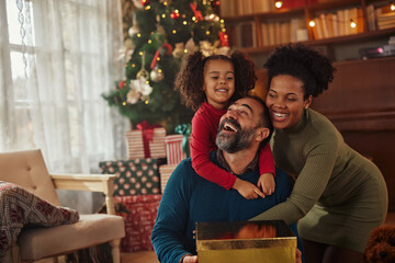 Small family having happy time together on Christmas.