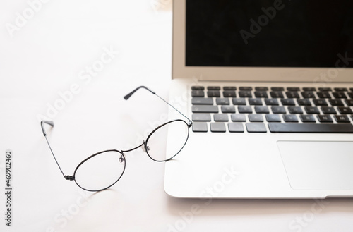 laptop on a glasses nice angle minimalistic white background 