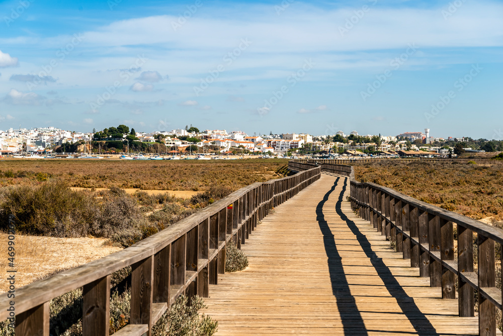 Wooden boardwalks by the coast of Alvor, Algarve, Portugal