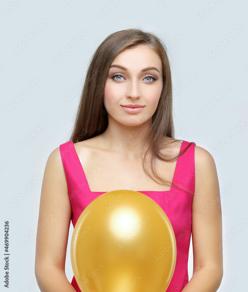 happy girl in a good mood posing with a balloon happy girl in a good mood posing with a balloon