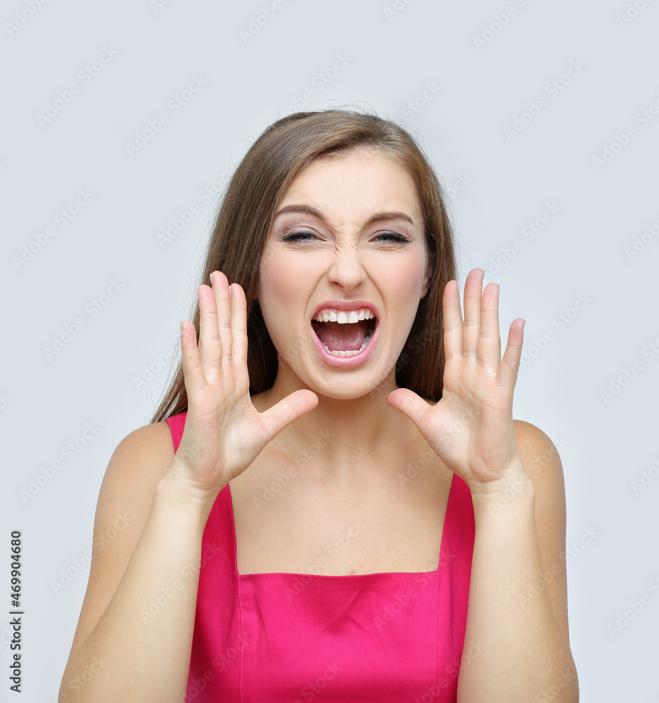 Fototapeta premium Portrait of beautiful girl screaming at the camera