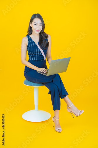 Portrait beautiful young asian woman smile with computer laptop