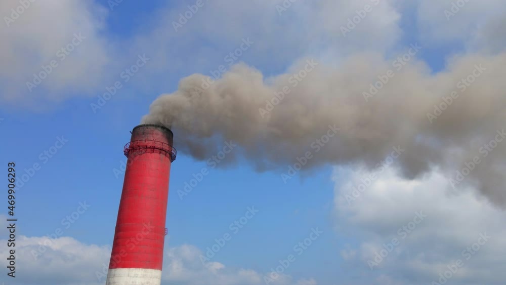 Aerial video. Slowmotion shot of a coal electric plant. Smoke coming out of three pipes of an old electric plant. Carbon emissions concept. Reduce CO2 emissions. Paris agreement. Developing countries Aerial video. Slowmotion shot of a coal electric plant. Smoke coming out of three pipes of an old electric plant. Carbon emissions concept. Reduce CO2 emissions. Paris agreement. Developing countries