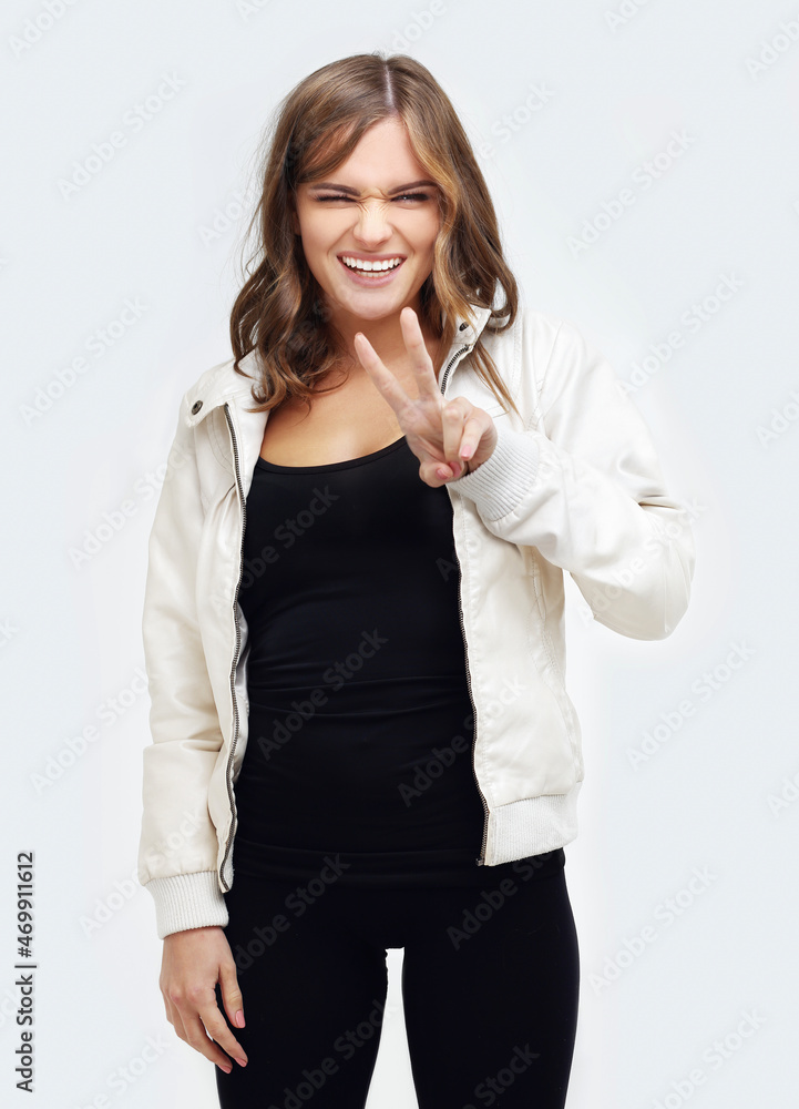 Teenage girl showing victory sign