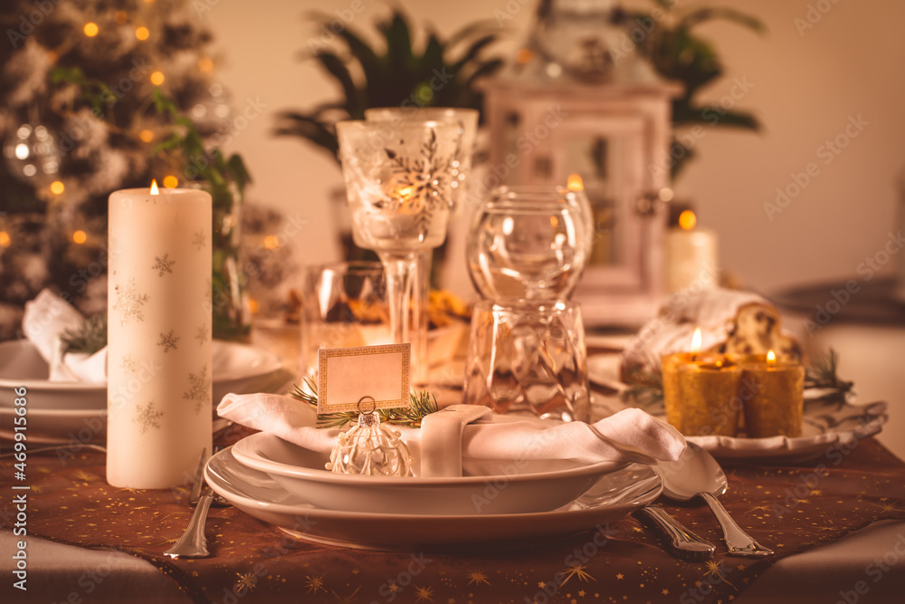 Festive Christmas table in golden tone Festive Christmas table in golden tone