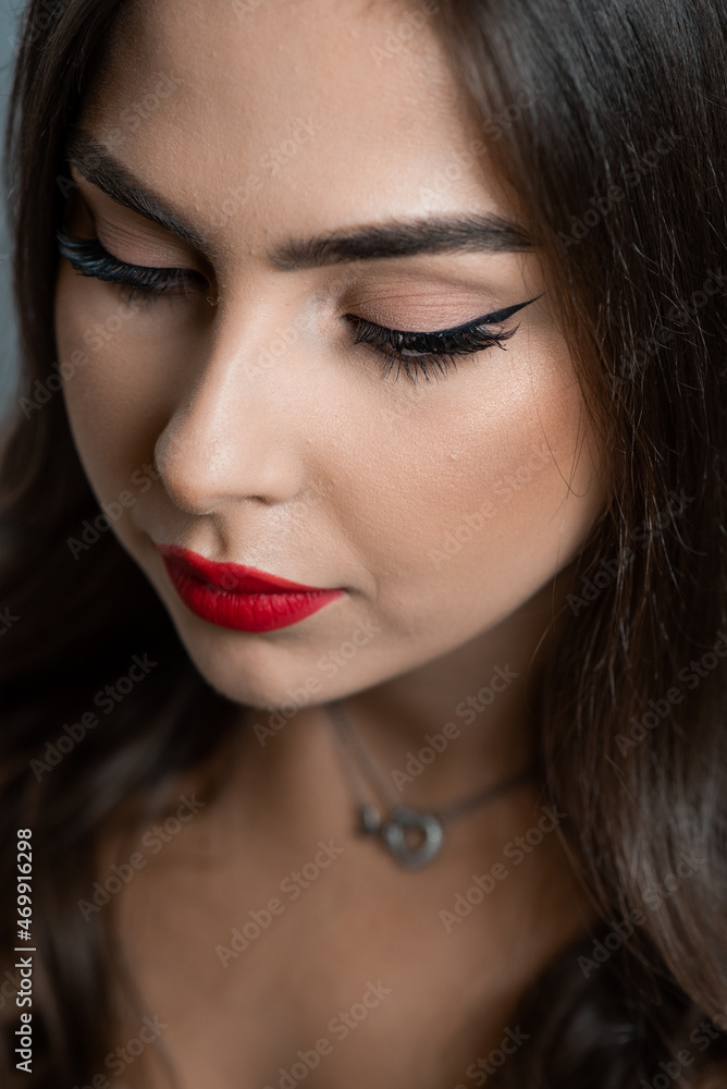 Beautiful young woman with make up and red lips Beautiful young woman with make up and red lips