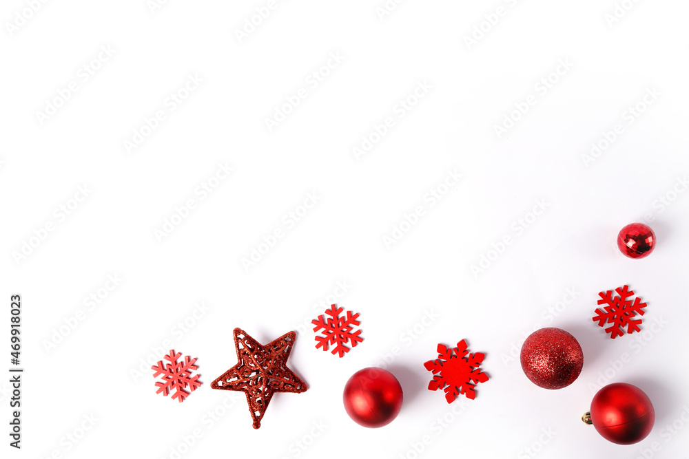 Red christmas ornaments on white background. Merry christmas card. Winter holiday xmas theme. Happy New Year. Space for text.