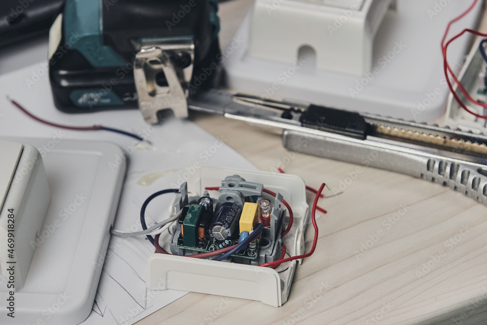 Repair of electronic devices, tin soldering parts. Hands of man holding screwdriver. Computer circuit board Repair of electronic devices, tin soldering parts. Hands of man holding screwdriver. Computer circuit board