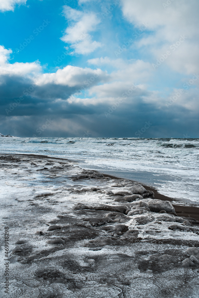 Winter landscape with frozen sea and icy beach. Storm and snow weather. Dramatic seascape. Winter landscape with frozen sea and icy beach. Storm and snow weather. Dramatic seascape.