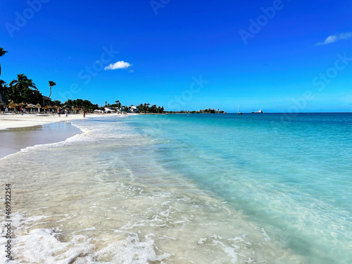 Dickenson Bay Antigua beach with palm trees