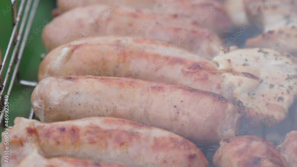 Delicious homemade pork sausages are grilled. view from above. street food. Selective focus Delicious homemade pork sausages are grilled. view from above. street food. Selective focus