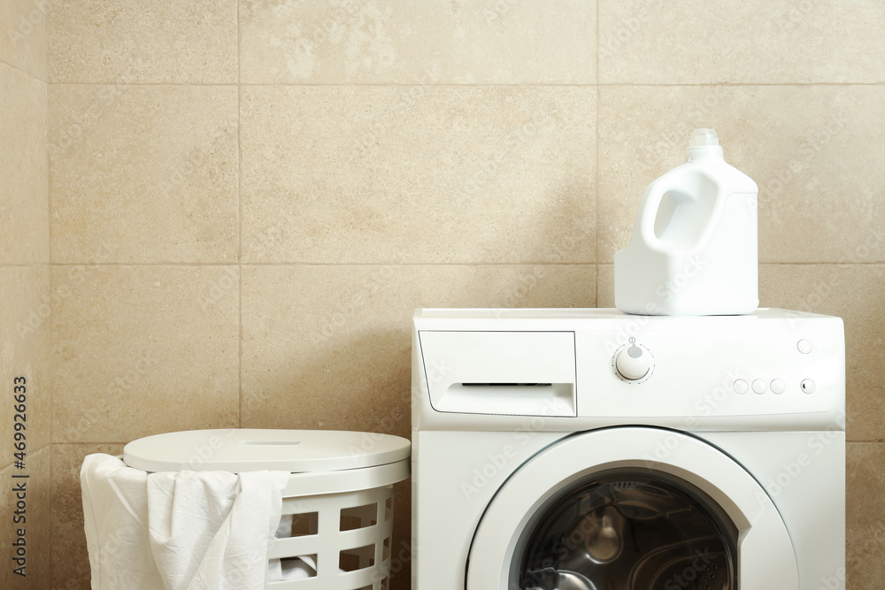 Concept of housework with washing machine in bathroom Concept of housework with washing machine in bathroom