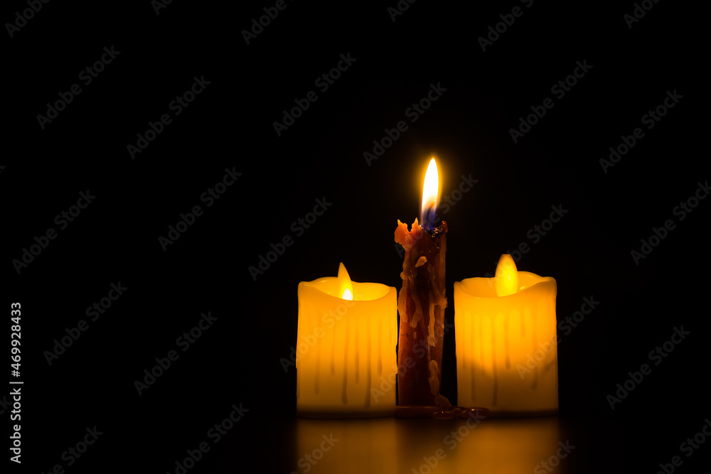 Christmas advent candle light in dark background well used for memorial day  religious ritual, spiritual zen meditation, peaceful mind and soul or  funeral worship ceremony Stock Photo | Adobe Stock